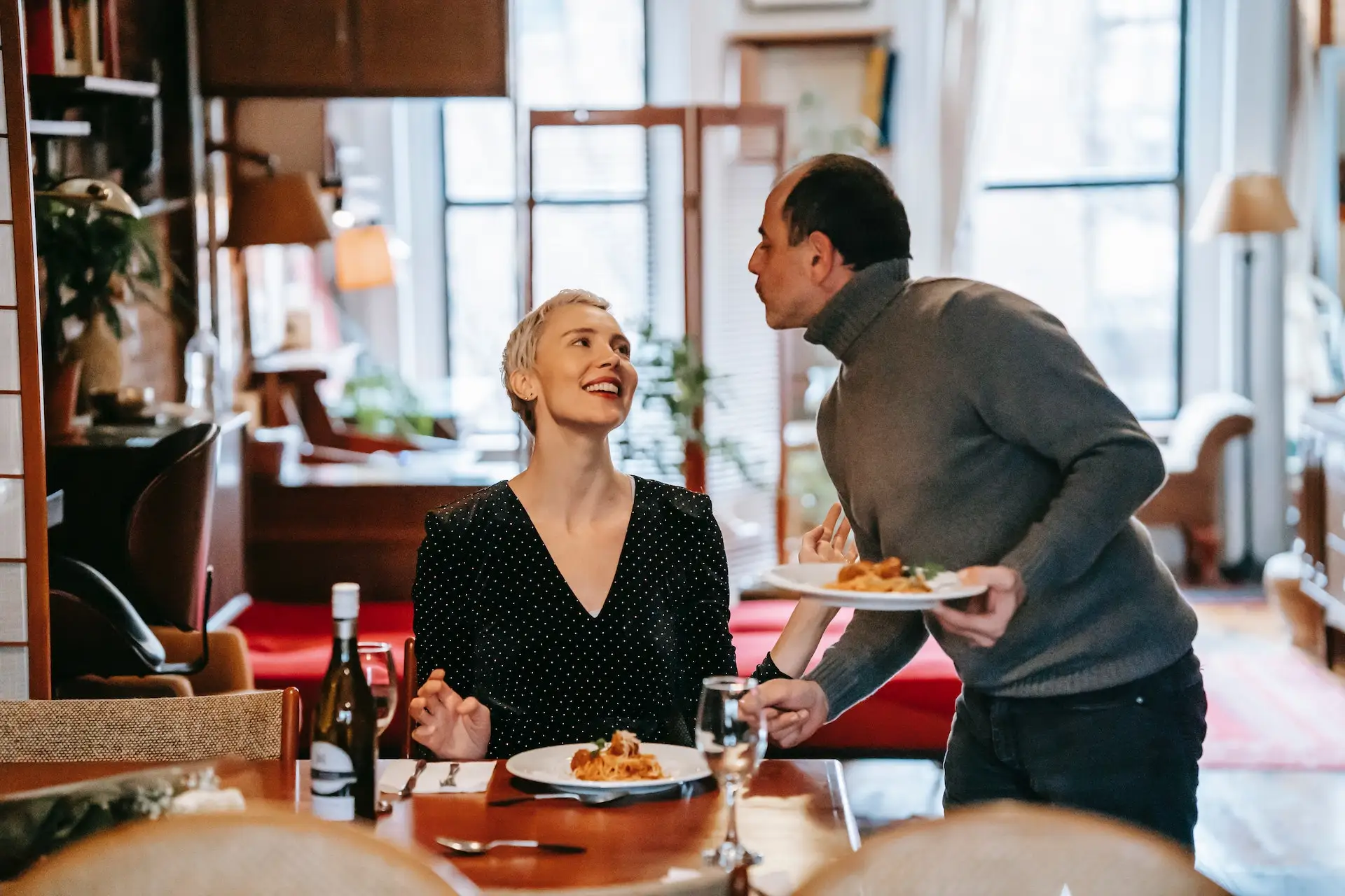 A couple having an at-home restaurant experience