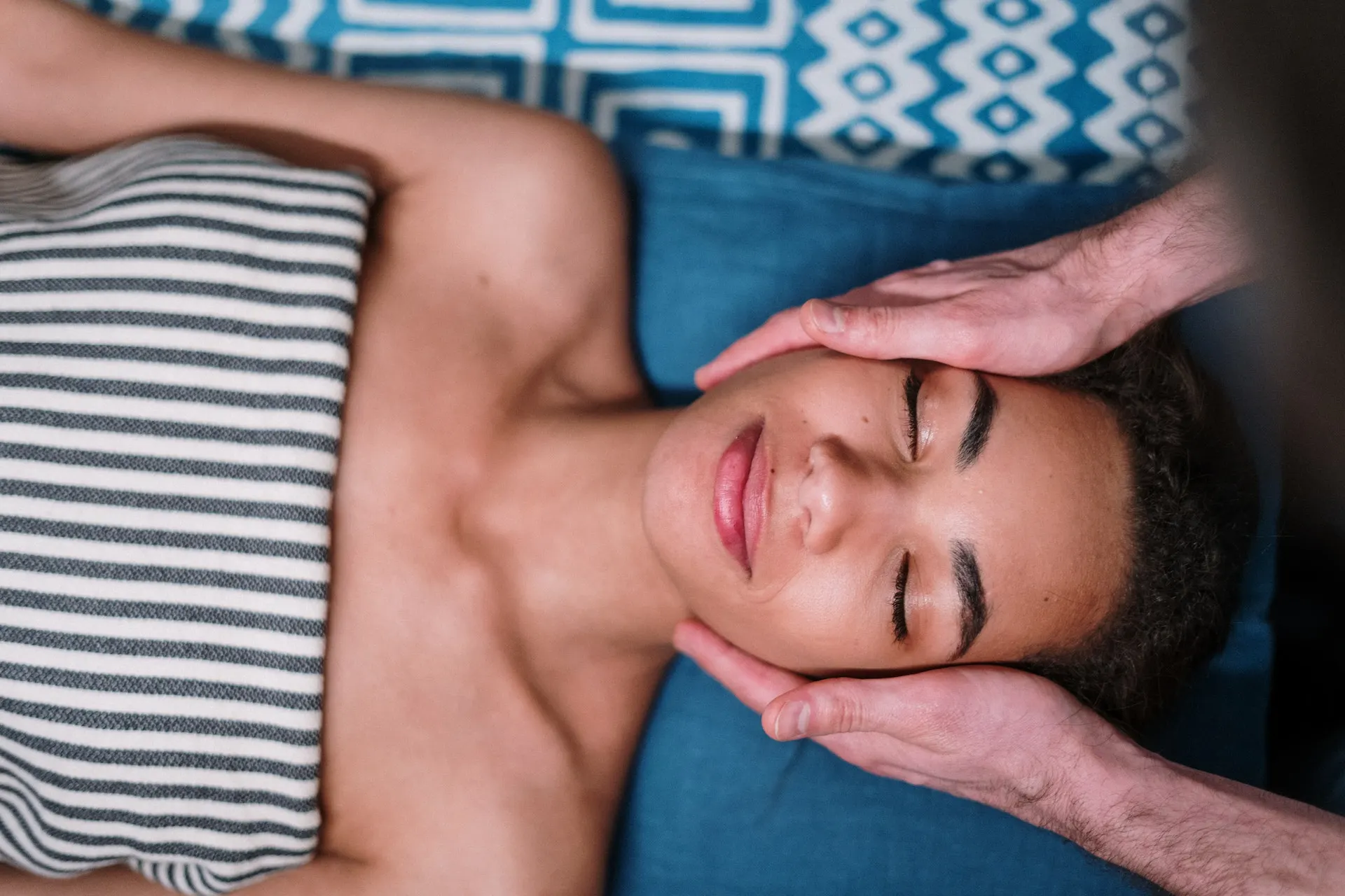 A man giving a sensual massage to his partner