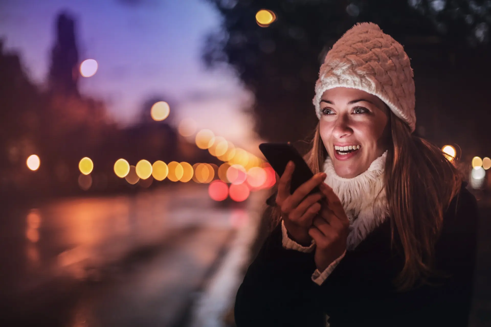 A woman listening to a recorded phone message